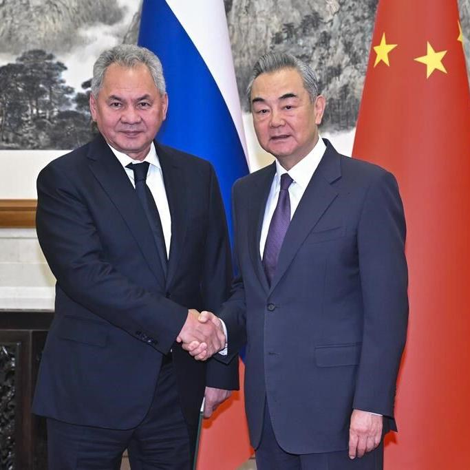 Russian defense official visits China's premier military showcase in a sign of unity